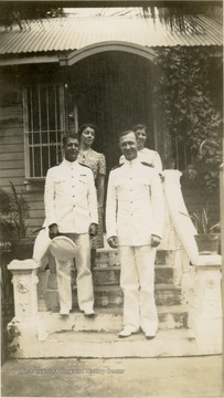 Candid portrait of husband and wife, Clifford and Eva Condon (standing,right) with unidentified couple. The men are wearing navy dress whites. The photograph was probably taken in the Philippines before the attack on Pearl Harbor, Hawaii. Clifford Condon was captured by the Japanese in December, 1941 and died in a POW Camp in 1945.