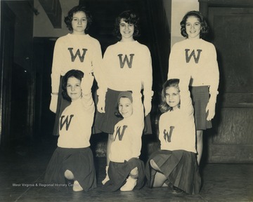 Group portrait of the Westover Junior High Cheerleaders in uniform; Only identified member is Barbara Palumbo, front right.
