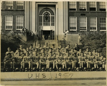 Portrait of the UHS Hawks Football Team. Coach Fizer is top row, right
