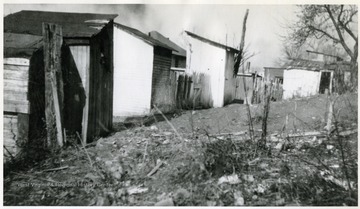 View of backyards with "pit closets".