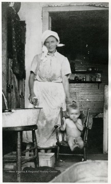Bath time at home of unidentified woman and child