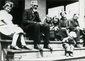 Left to Right: Mildred Ashcraft, Francis Marion Ashcraft, Eleanor Ashcraft, Lucille Ashcraft, Nancy Jane Ashcraft, William H. Ashcraft, and Mike Ashcraft. The parents of the children are Henry and Nell Ashcraft.