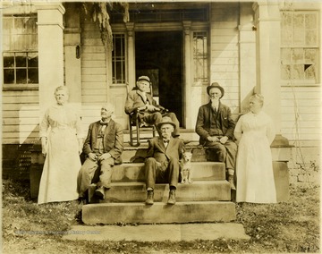 Left to Right: Maria Price, Albert Price, unidentified man in rocking chair, Uncle Oliver Price, Uncle John Price, and Aunt Jane Price.
