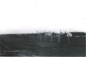 A fence separates the WAC (Women's Army Corps) and French War Brides living areas from the rest of the camp. There were approximately 6,500 French War Brides, many left France with their husbands to live in America. 