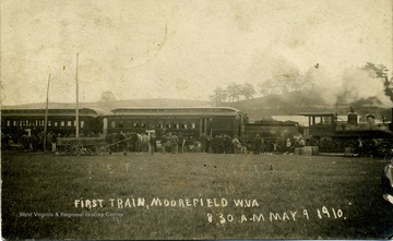 The Hampshire Southern Railroad train stands on the track, fired-up in Moorefield, Hardy County, West Virginia. The photograph shows only passenger cars, however the Hampshire Southern's first line also included freight service. The line ran between Romney and Moorefield.