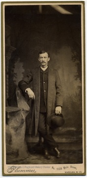 Well dressed man poses for a portrait in a Wheeling, West Virginia studio.