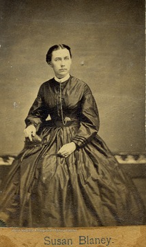 Portrait of Susan Blaney, probably from Morgantown, West Virginia. Her dress and hair style were popular fashion in the mid to late 1860's.