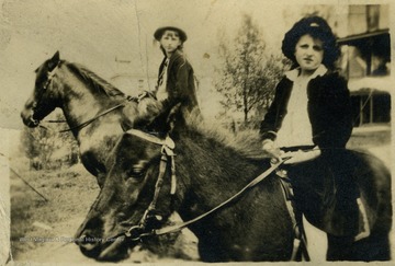 Rebecca Wade, left and Margaret Mathers, right, riding horseback.