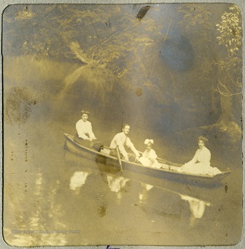 Anna Mathers, wife of Max Mathers, their daughter, Margaret and Stella C. DeGant, Anna's sister enjoying a boat ride on the Cheat River.