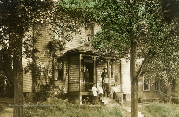 Unidentified members of possibly the Mathers family outside the house in Morgantown.