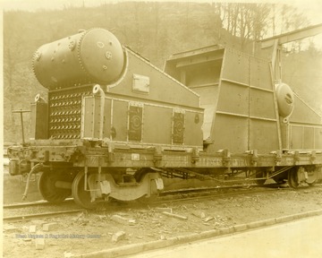Ward boiler being transported on a train. Built by Charles Ward Engineering Works in Charleston, West Virginia.