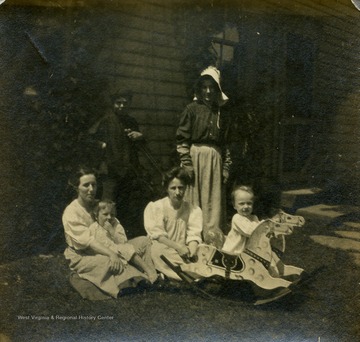 Blanche Lazzell of Maidsville, West Virginia poses with her family on the lawn.