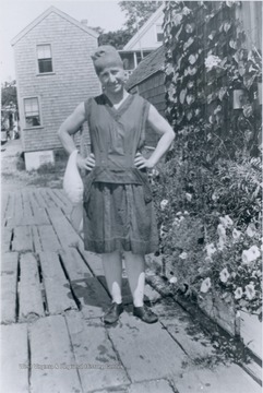 Blanche Lazzell poses outside her studio on the Massachusetts shore, wearing the bathing suit fashion of the day.