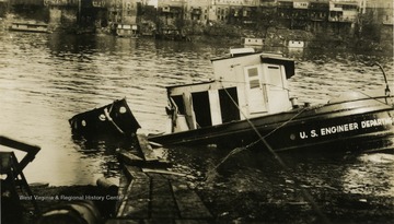 Half sunken towboat wreck. Boat built by The Charles Ward Engineering Works in Charleston, West Virginia.
