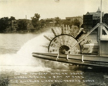 Duncan Bruce Towboat wheel turning at 14 RPM at the riverbank, designed by The Charles Ward Engineering Works in Charleston, West Virginia.