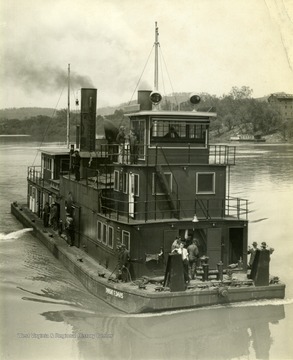 The Ship "Dwight F. Davis" sails through the water. This ship was built by The Charles Ward Engineering Works in Charleston, West Virginia.