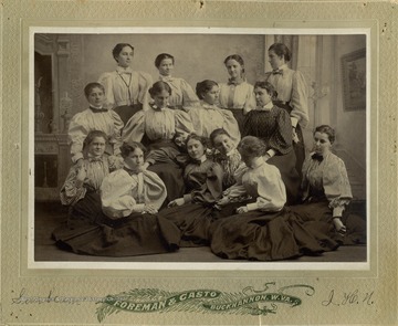 Inscribed on the back of the photograph, "King's Daughters, "Fear no evil, but scatter sunshine" - Motto. Members listed in photo: Mollie Throckmorton, Irene Coffield, Ivie Hardman, Clarice Ripley, Nellie Howard, Bo peep Smith, Minnie Core, President, Maud Sheats, Bessie Martin, Blanche Lazzell, Flo Friend, Gertrude Wheeler, Dot Stuart, Lidia Shroth