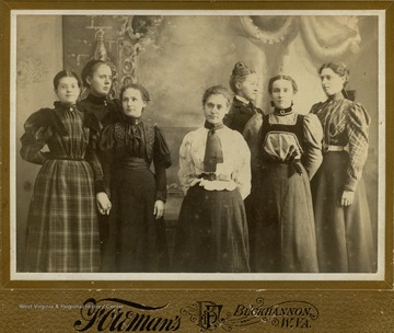 Left group: Stella Elliott ("Ma Steller Ruggles"); Lotta Kump, ("Little Larry Ruggles"); Blanche Lazzelle ("Susan Ruggles"). Right group: Della Haymond ("Aunt Deller Ruggles"); May Ruffin ("Kat Ruggles"); Virginia Rider ("Sarah Mand Ruggles"); Flora Sanders ("Peora Ruggles")