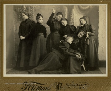 Inscribed on the back of the photograph, "The lads took the new lasses and the old lasses were left to mourn." Listed in the photograph: Sicely Wilson; Osa Lawson; Gertrude Wheeler; Blanche Lazzelle; Eirlah Davis' Mabel Wiant; Sadie Donley.
