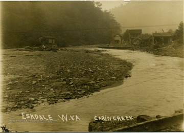 Postcard photograph of Cabin Creek at low water level in Eskdale. Information on the back: " Hinton Daily News Collection - John Faulkner Collection,  from Jim Pettrey to Stephen Trail 1997".