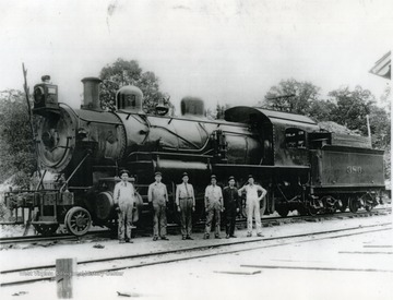 Unidentified railroad workers pose in front of Chesapeake and Ohio Engine No.380. The photograph was possibly taken at a depot in Summers County. Information on the back includes: "From Roy Long Coll. C &amp; O RR".