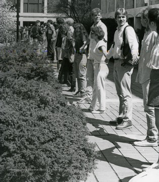 WVU student protest - "Death of Higher Education" and show unity by holding hands in a long line, in front of Mountainlair, in Morgantown, West Virginia.