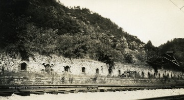 Inscribed on the back of the photograph, " A forgotten industry, old coke ovens at Elkhorn". 
