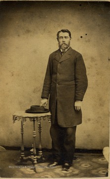 A carte de visite of a well dressed, bearded, J. M. Young.