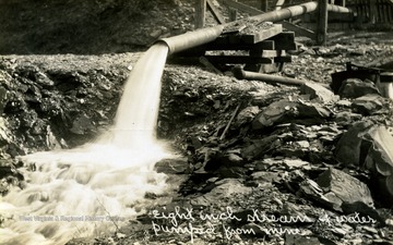 An eight inch stream of water pumped from a C.H. Mead Coal Company Coal mine.