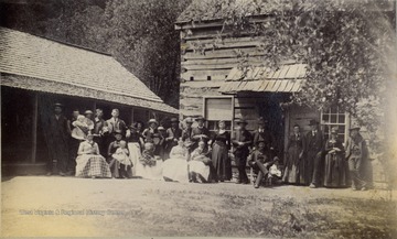 Group portrait of several families of the workers building the Ohio Extension of the Norfolk and Western Railroad along the Tug Fork and Big Sandy Rivers.