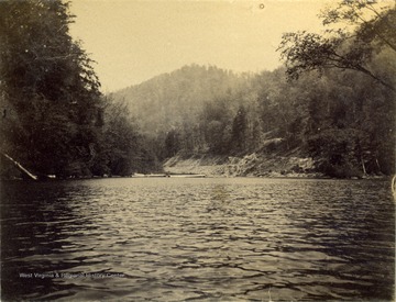 View of the Tug Fork River, looking from the Civil Engineers' Camp 6. The photograph was taken during the building of the Ohio extension of the Norfolk and Western Railroad.