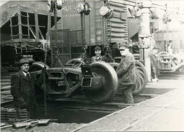 Train maintenance workers L to R : A. C. Via, Noah Richmond, "Big Boy" Karnes