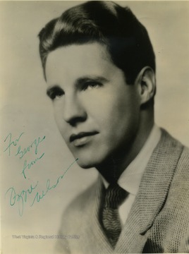 This is an autographed portrait of American actor Ozzie Nelson of the T.V. series "Ozzie and Harriet". He performed at the Warner Theater in Morgantown, West Virginia. The photo was collected by Mike and George Barrick, two WVU students. The photo is signed "To George from Ozzie Nelson". 