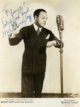 This is a photo of Barney Rapp of Barney Rapp and the New Englanders. He performed at the Met. in Morgantown, West Virginia. The photo was collected by WVU students George and Mike Barrick and is signed "To George Lot's of Luck 1940 Barney Rapp". 