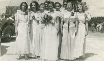 The first annual Mason County Potato Festival began on August 1, 1938. It was created to encourage agriculture. This photo depicts the Potato Queen and her court. All persons are unidentified. 