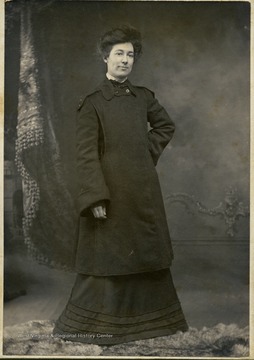 Mrs. Belle McEwen wearing a coat styled for the fashion of the day.