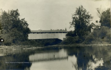 Designed and built by Lemuel Chenoweth, the bridge spans the Tygart Valley River. The Chenoweth home can be seen on the right. Lemuel Chenoweth was a renown architect and bridge designer in Western Virginia before the Civil War. 