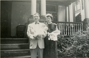 This is a photograph of George and Sarah Barrick. George is holding their son George Barrick III. They are in Morgantown, West Virginia. 