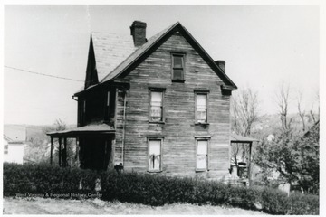 John Edwards ran the first water service in Morgantown. He married Sarah Jackson in 1865 and bought the land that he built his house on in 1877. It was originally 79 White Avenue. It is now 477 White Avenue. The house was demolished in 1989. Information on p. 35 in "Our Monongalia" by Connie Park Rice. Information with the photograph includes "Courtesy of Gwendolyn Edwards".