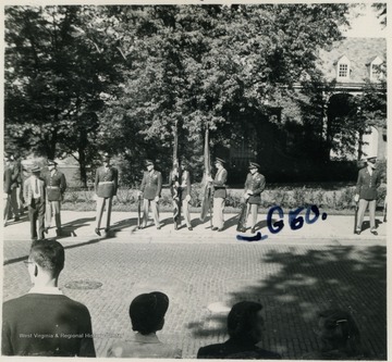 Captain George Barrick Jr. (labeled) to the far right, stands with the ROTC Units waiting for General Eisenhower's arrival. All persons in this photograph are unidentified.