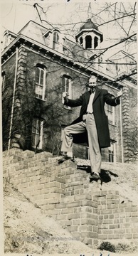Unidentified student poses behind Martin Hall.