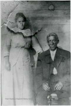 The woman next to Dixon is thought to be his second wife, Alvie. They are Sarah Dixon Edwards' parents and James A. G. Edwards' in-laws. William Dixon contributed to an article titled "Negro Tales from West Virginia". Information on p. 94 in "Our Monongalia" by Connie Park Rice. Information with the photograph includes "Courtesy of Gwendolyn Edwards".