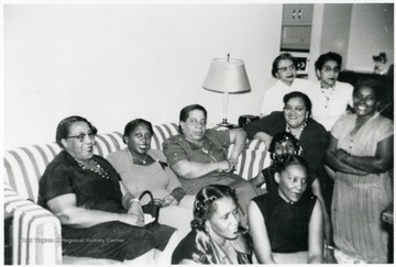 Back Row Seated L to R : Bula Cobbs, Clavette Blue, Gertrude Viney. Front Row: Helen Stevens, Nettie Parker, Pricilla Blue. Clockwise Flavia Holland, Mabel Cloe, Jackie Cranford and Corrine Edwards. Information on p. 137 in "Our Monongalia" by Connie Park Rice. Information with the photograph includes "Courtesy of Ivry Moore Williams".