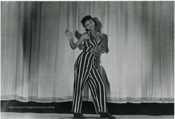 Young Zula Mae McKinley dancing on stage. Information on p. 128 in "Our Monongalia" by Connie Park Rice. Information with the photograph includes "Courtesy of Ivry Moore Williams".