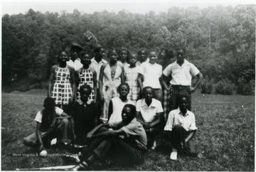 Camp Muffly was a 4-H site in Monongalia County. Segregated black and white members attended Camp Muffly in Clinton District at different times. All persons in the photo are unidentified. Information on p. 138,139,140 in "Our Monongalia" by Connie Park Rice. Information with the photograph includes "Courtesy of Ivry Moore Williams."   