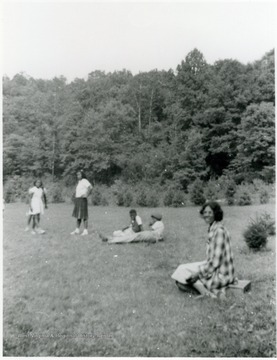Camp Muffly was a 4-H site in Monongalia County. Segregated black and white members attended Camp Muffly in Clinton District at different times. All persons in the photo are unidentified.Information on p. 138,139,140 in "Our Monongalia" by Connie Park Rice. Information with the photograph includes "Courtesy of Ivry Moore Williams."   