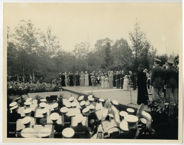 Inscribed on the back of the photograph, "Crowning of the 'Cherry River Navy's Sweetheart' - 1938 during the Spud &amp; Splinter Festival, Richwood, Nicholas County".