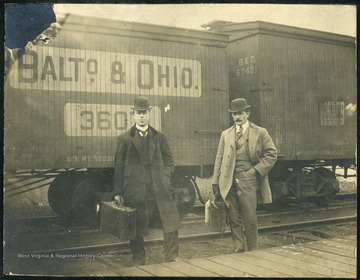 The Baltimore and Ohio Railroad Company was one of the oldest railroads in the United States. It passed through Maryland, West Virginia, Virginia and Ohio. The two men are possible WVU students headed out of Morgantown.