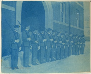 Cadets standing with shouldered arms. All persons in the photograph are unidentified. 