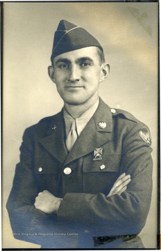 Layne Ford, son of Gene and Ada H. Ford wearing army dress uniform. The photograph was taken while he was on leave for the holidays during World War II. 